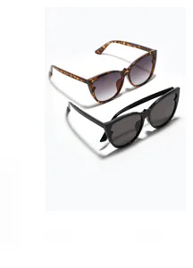 Detailed close-up of tortoise shell and black cat-eye sunglasses with gradient lenses