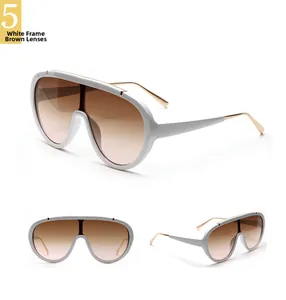 Detailed view of white frame shield sunglasses with tea gradient lenses and metal temples