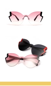 Detail view of model A1165 butterfly sunglasses with CE mark and side frame design
