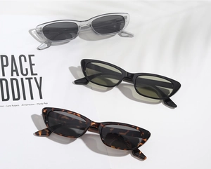 Detailed view of square small-frame sunglasses in grey, black, and tortoise shell