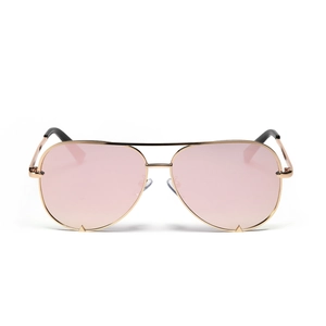 Classic aviator sunglasses with gold metal frame and pink gradient lenses on white backdrop
