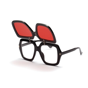 Detail of creative double-layer flip-up sunglasses with red lenses and black frames