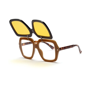 Detail of creative double-layer flip-up sunglasses with thick brown frames and yellow lenses