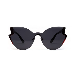 Retro butterfly cat eye sunglasses with oversized black lenses and red jagged accents