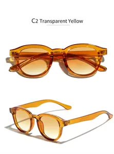 Vue détaillée des lunettes de soleil rondes jaune transparent avec marquage CE sur la branche