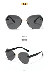 Detail view of C4 model rimless polygon sunglasses with grey lenses and gold metal bridge