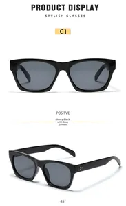 Detail view of stylish square black sunglasses featuring classic gold triple rivet accents