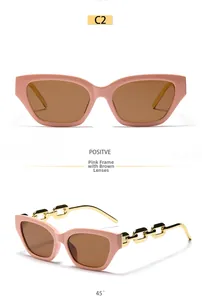 Pink cat-eye sunglasses with tea lenses and decorative gold metal chain temples