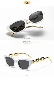 Detail view of white square sunglasses featuring oversized gold metal chain temples