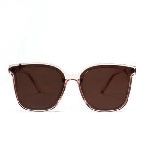 Modern oversized sunglasses with pink transparent frames and brown tinted lenses