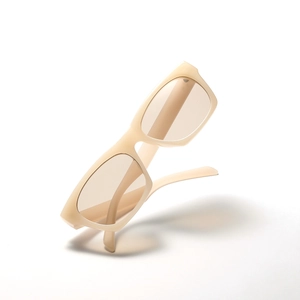 Modern rectangle frame sunglasses in beige with light brown lenses shown at a dynamic angle
