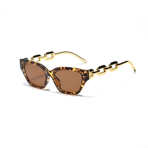 Retro cat-eye tortoise sunglasses for women featuring chunky gold chain metal temples