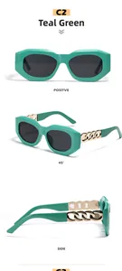 Detail of teal geometric sunglasses featuring fashionable metal chain link temple design