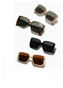 Retro rectangular oversized sunglasses in tortoiseshell, black, and cream frame colors