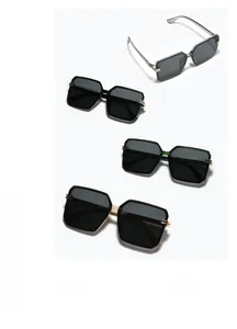 Detail of four square oversized sunglasses with gold and silver metal temples