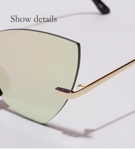 Vue détaillée de lunettes œil-de-chat sans monture avec charnières en métal doré haut de gamme
