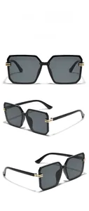 Three-view display of black square oversized sunglasses with gold metal hinge detail