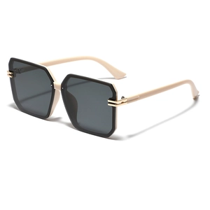 Chic oversized square sunglasses with ivory and black two-tone frames and gold accents