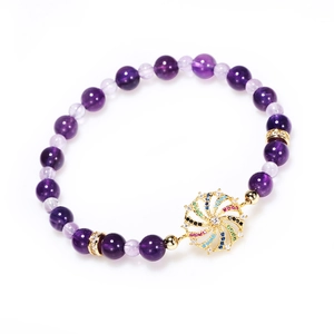Purple amethyst beaded bracelet with colorful rhinestone spinning pendant in gold finish