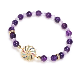 Women's purple amethyst beaded bracelet with colorful rhinestone gold sunburst pendant