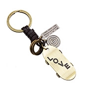 Detail of vintage fishbone keychain with brown braided leather strap and gold love pendant