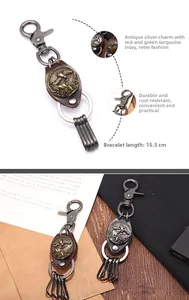 Macro detail of retro metal horse keychain with turquoise inlay and leather strap