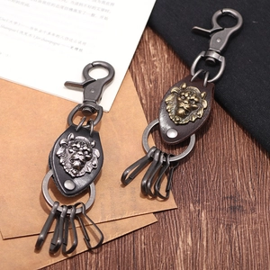 Retro lion head leather keychain with vintage metal buckle and braided strap detail