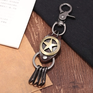 Porte-clés vintage en cuir avec emblème d'étoile en bronze et fermoir mousqueton