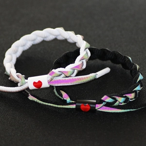 Reflective braided shoelace bracelets in black and white with red heart adjusters
