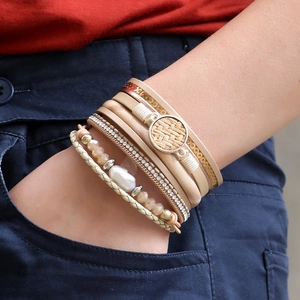 Bohemian multi-layer wrap bracelet with pearls, rhinestones and magnetic buckle on wrist