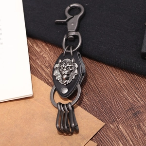 Retro lion head metal emblem on black braided leather keychain with gunmetal hardware