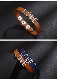 Detail of PU leather bracelets with silver LOVE letters and adjustable metal snap buttons