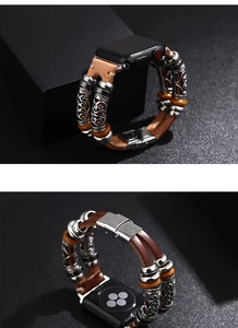 Detail of vintage brown leather strap for iWatch with silver beads and metal buckle