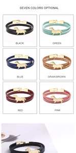 Multiple colors of double-wrap leather bracelets featuring golden dachshund metal charms