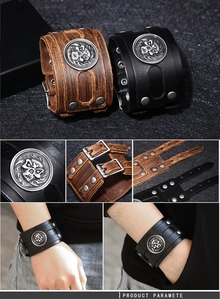 Detail view of punk wide leather bracelet with silver skull relief and adjustable buckles