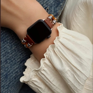 Bohemian style brown leather and silver bead strap for Apple Watch on female wrist