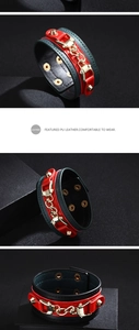 Detail of adjustable PU leather bracelet with gold chain and metal studs in punk style