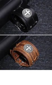 Close-up of vintage leather bracelets with cross metal charms in black and brown