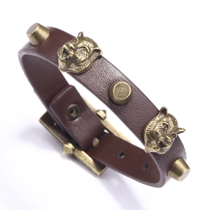 Vintage dark brown leather bracelet featuring bronze tiger heads and adjustable buckle