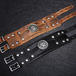 Vintage wide leather punk bracelets in black and brown with metal studs and skull motifs