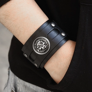Vintage punk black leather wide wristband with skull emblem and silver metal studs