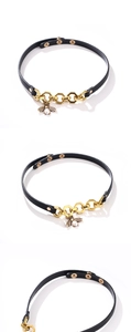 Detail of bee pendant with pearl on black leather choker and adjustable gold snaps