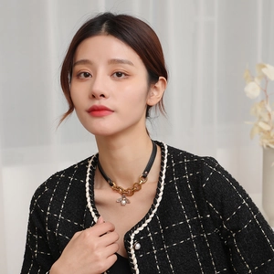 Vintage bee choker with gold chain, black PU leather and a pearl insect pendant
