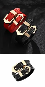 Close-up of double-wrap PU leather bracelets with snake texture and large gold buckles