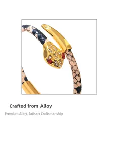 Detail of snake shape bracelet with gold alloy finish and micro-inlaid rhinestones
