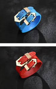 Detail of red and blue faux leather wrap bracelets with gold buckle closures