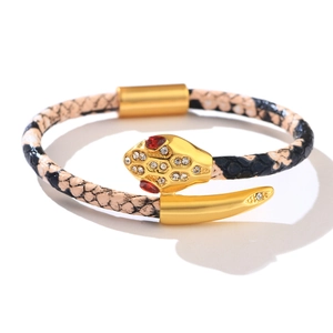 Snake head bracelet with gold hardware and snakeskin pattern featuring zircon accents
