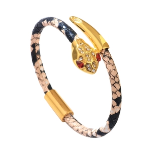 Snake wrap bracelet featuring sparkling pavé crystals and realistic snake skin texture leather