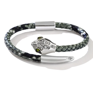 Luxury snake-patterned leather bracelet featuring a crystal-set silver snake head and green eyes
