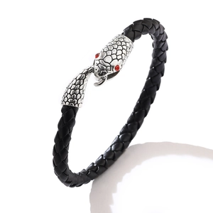 Men's black woven leather bracelet with antique silver snake head clasp and red stone eyes